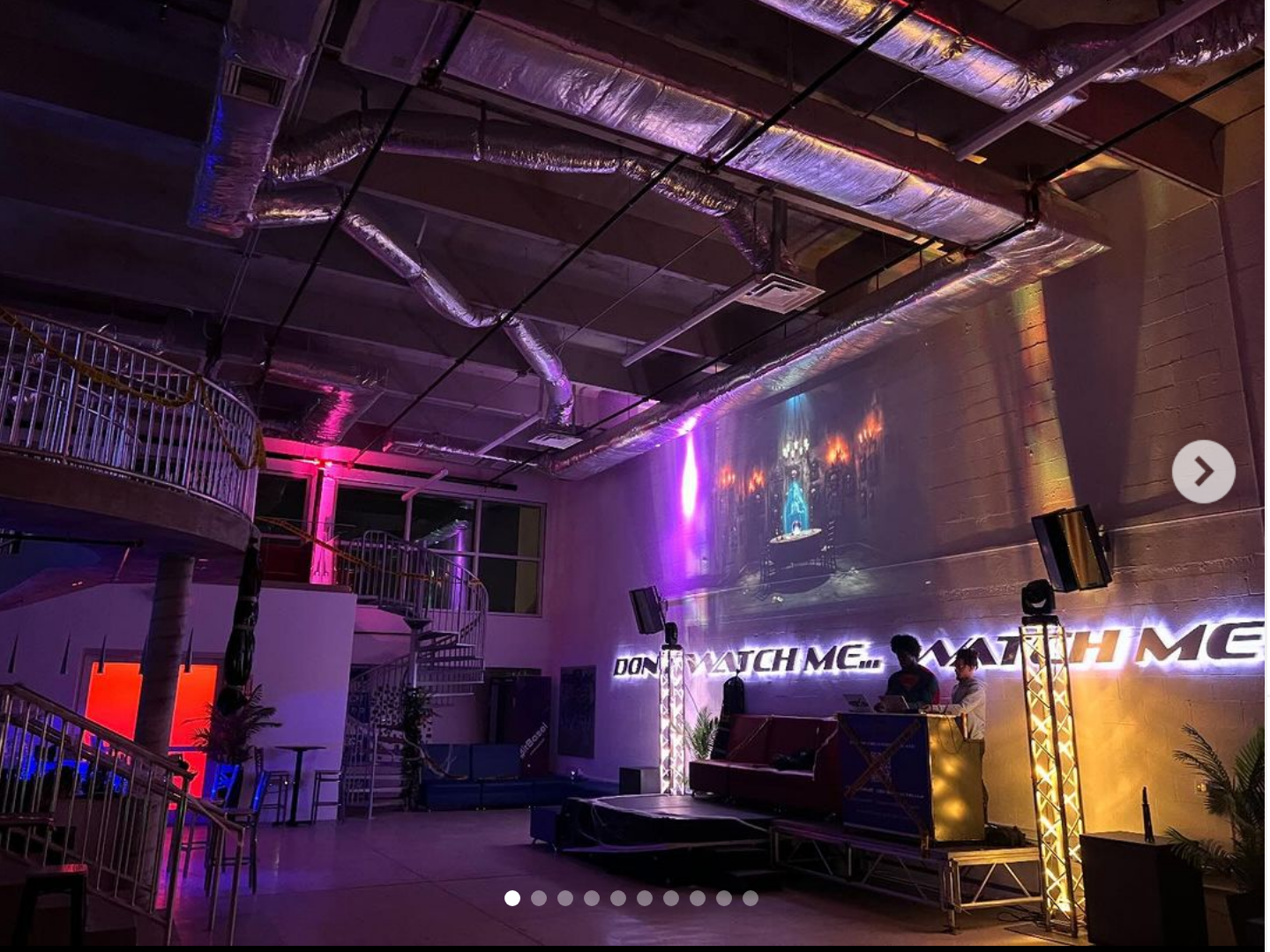 image depicting the inside of PS Social Miami venue | 51 NW 36th Street. pictured in low light with stage and dj booth set for a social event